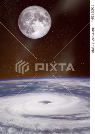hurricane over the ocean with full moon in backgro hurricane over the ocean with full moon in backgro 44926302