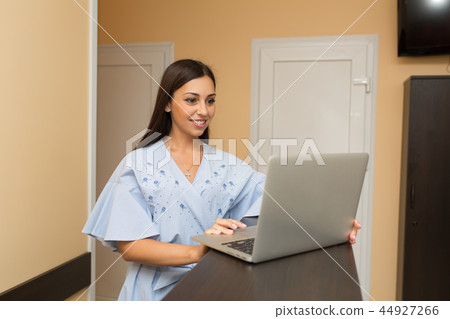 beutiful woman on reception working at laptop beutiful woman on reception working at laptop 44927266
