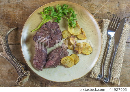 Dear meat roasted with potatoes 44927903