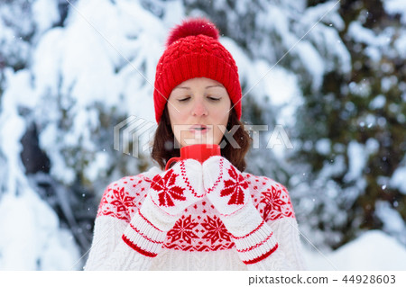 Woman drinks Christmas chocolate. Girl with cocoa. Woman drinks Christmas chocolate. Girl with cocoa. 44928603
