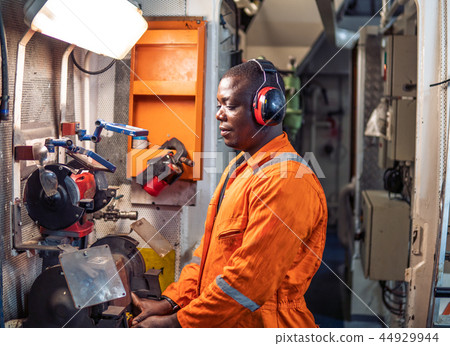 Marine engineer officer working in engine room Marine engineer officer working in engine room 44929944