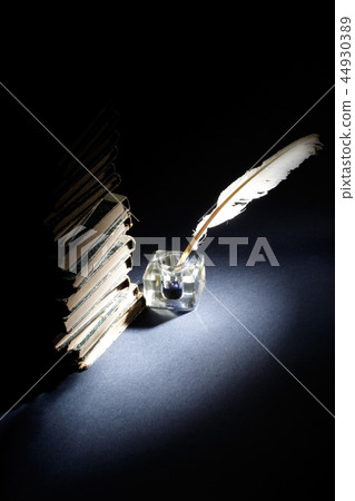 Old fountain pen, papers and inkwell on black 44930389