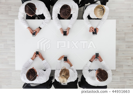 Business people using smartphones Business people using smartphones 44931663