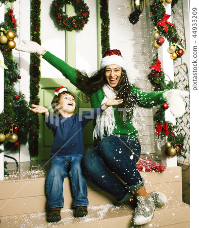 happy smiling family on Christmas at house with gifts, young mot 44933209