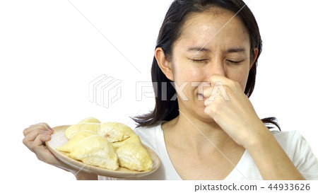 Asian girl smelling stinky durian. Smelly fruit  44933626