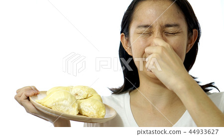 Asian girl smelling stinky durian. Smelly fruit  44933627
