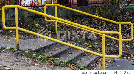 Yellow handrails near the stairs. cloudy days Yellow handrails near the stairs. cloudy days 44941252