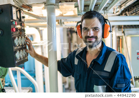 Marine engineer officer working in engine room 44942290