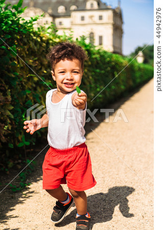 Cute little latin-american boy in red shorts Cute little latin-american boy in red shorts 44942976