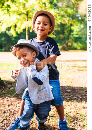 Two happy brothers fooling around and playing 44943016