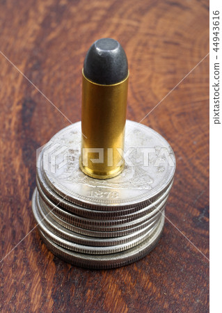Revolver cartridge and Silver Dollars Revolver cartridge and Silver Dollars 44943616