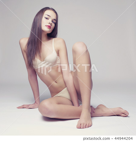 Elegant sitting lady 44944204