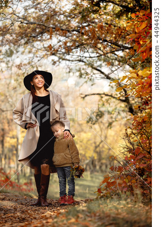 charming beautiful mother walks with little daughter girl 44944325