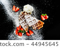 Belgian waffles with sugar icing and strawberries 44945645