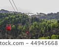 many cable carts over the mountain in snow 44945668