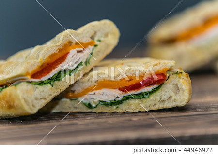 Delicious sandwich with meat and fresh vegetables Delicious sandwich with meat and fresh vegetables 44946972
