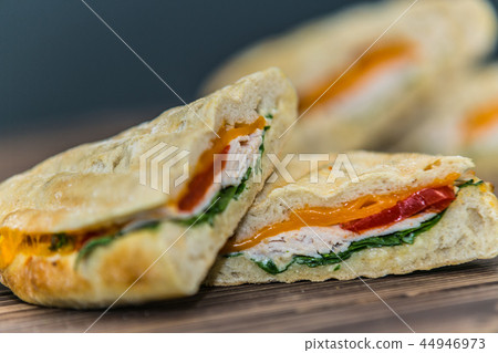 Delicious sandwich with meat and fresh vegetables Delicious sandwich with meat and fresh vegetables 44946973