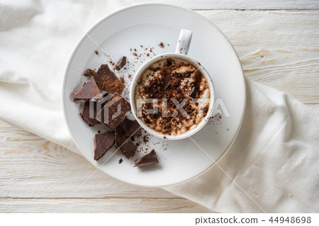 A cup of cocoa and chocolate closeup 44948698