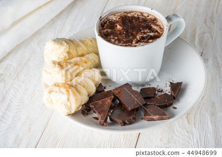 Morning breakfast, a cup of coffee and croissants 44948699