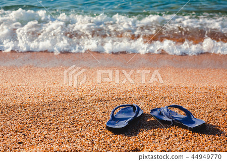 blue Slippers on the beach Lloret de Mar 44949770