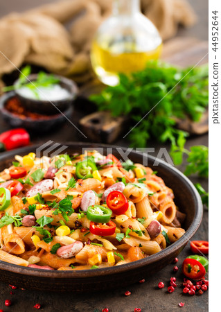 Spicy pasta penne bolognese with vegetables Spicy pasta penne bolognese with vegetables 44952644