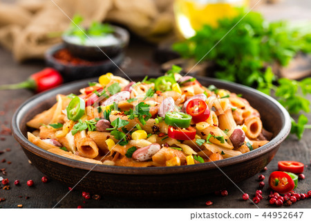 Spicy pasta penne bolognese with vegetables Spicy pasta penne bolognese with vegetables 44952647
