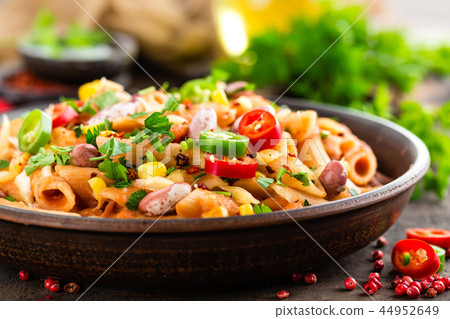 Spicy pasta penne bolognese with vegetables Spicy pasta penne bolognese with vegetables 44952649