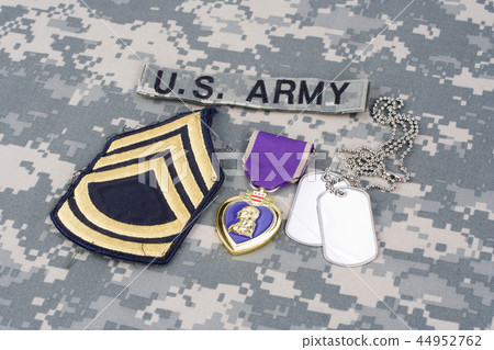 Purple Heart award on US ARMY camouflage uniform Purple Heart award on US ARMY camouflage uniform 44952762