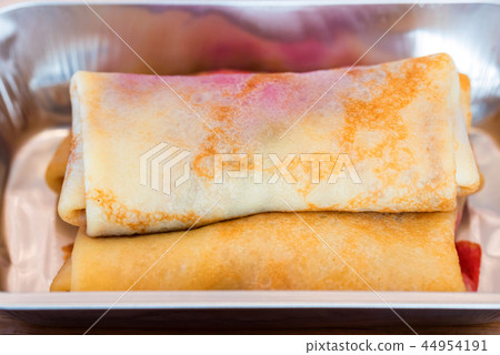 Sweet pancakes with stuffing served as airplane food 44954191