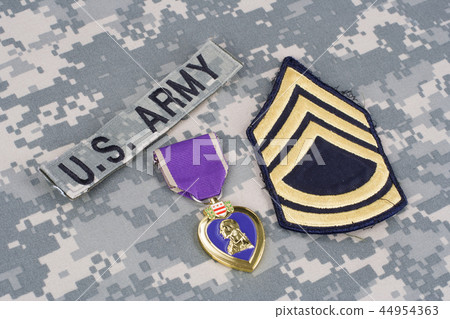 Purple Heart award on US ARMY camouflage uniform 44954363