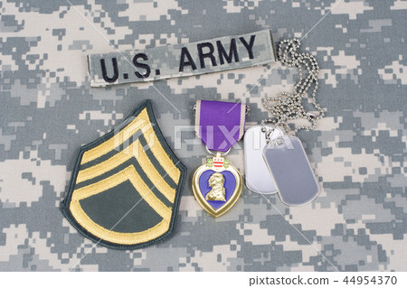 Purple Heart award with dog tags on uniform 44954370
