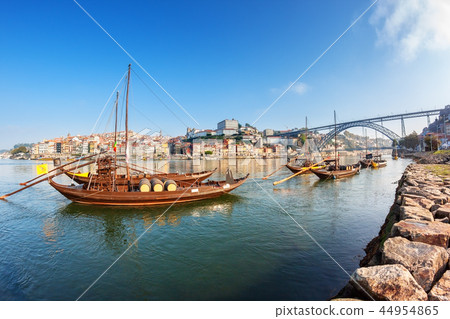 Traditional boats with barrels of wine, on the Douro River in the Portuguese city of Porto. 44954865