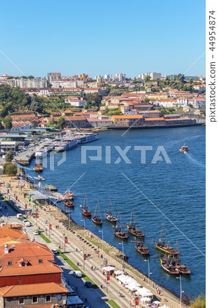 Traditional boats with barrels of wine, on the Douro River in the Portuguese city of Porto. 44954874