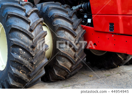 Close up brand new tractor tires at industrial factory Close up brand new tractor tires at industrial factory 44954945