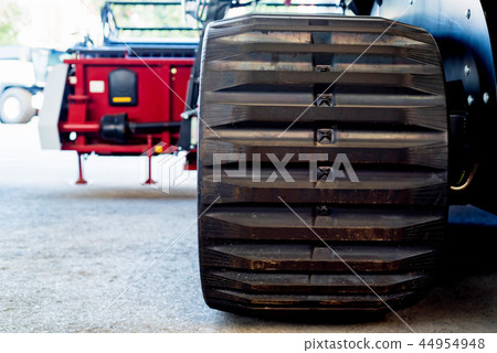 Close up brand new tractor tires at industrial factory 44954948
