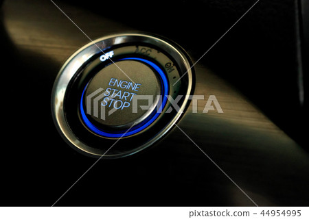 Engine start button in modern car close 44954995