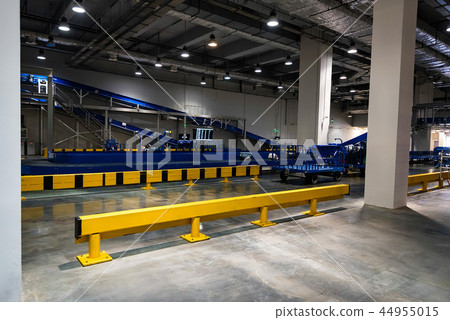 Baggage claim area with baggage carousels and carts Baggage claim area with baggage carousels and carts 44955015