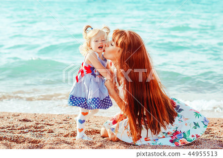 mother and daughter by the sea 44955513
