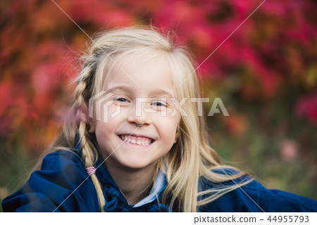 Happy cute blondy baby girl smiling outdoors Happy cute blondy baby girl smiling outdoors 44955793