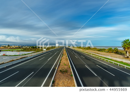 Ultra long exposure of empty freeway and cloudscape Ultra long exposure of empty freeway and cloudscape 44955989