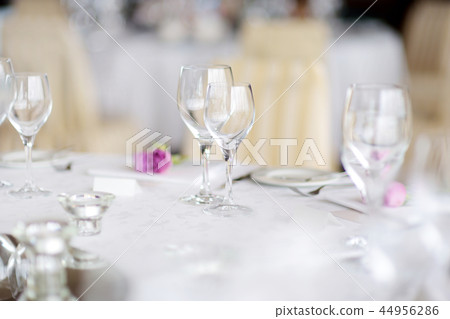 Beautiful table setting with crockery and flowers Beautiful table setting with crockery and flowers 44956286