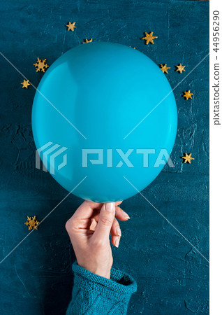 Woman holding the blue ballon Woman holding the blue ballon 44956290