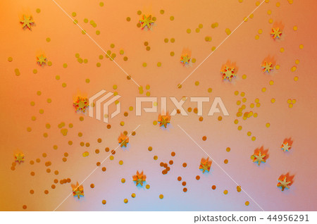 Festive yellow background with golden confetti Festive yellow background with golden confetti 44956291