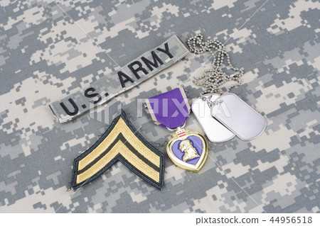 Purple Heart award with dog tags on uniform 44956518