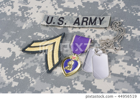 Purple Heart award with dog tags on uniform 44956519