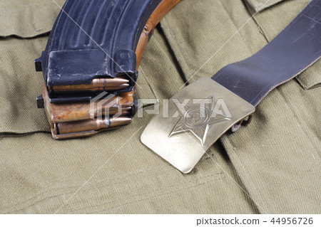 vintage buckle on USSR Soviet Army khaki uniform background vintage buckle on USSR Soviet Army khaki uniform background 44956726