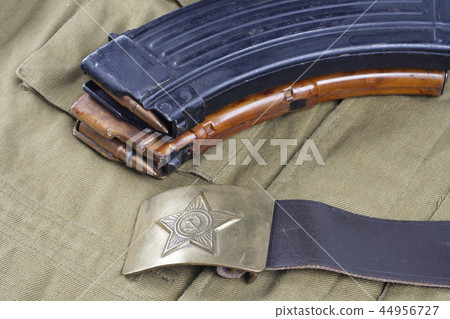 vintage buckle on USSR Soviet Army khaki uniform background vintage buckle on USSR Soviet Army khaki uniform background 44956727