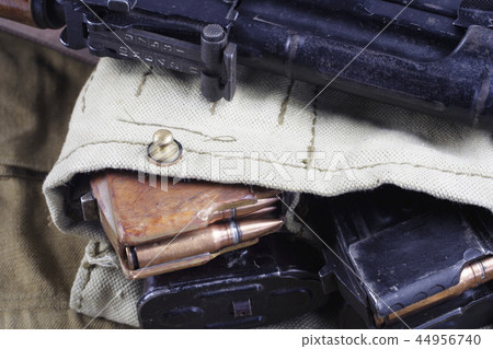 AK47 on USSR Soviet Army khaki uniform background 44956740