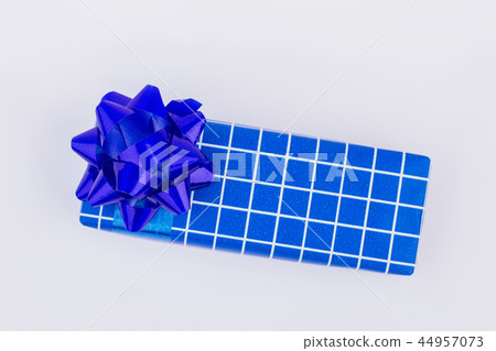 Blue gift box with white plaids. Blue gift box with white plaids. 44957073