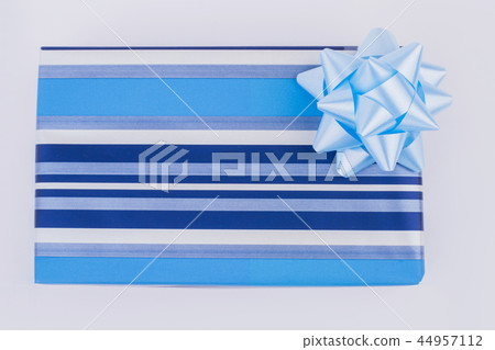 Gift box with light blue ribbon. Gift box with light blue ribbon. 44957112